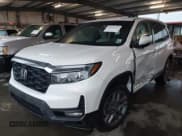 ✅ 2023 Honda Passport EX-L • VIN: 5FNYF8H5XPB023040 • Lot: 41904058. Listed on IAAI with 69,834 mi. Free auction sales archive from the USA and detailed vehicle history report at DreamBid. Image 2.