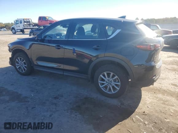 ✅ 2023 Mazda CX-5 S • VIN: JM3KFBAM0P0182840 • Лот: 86800735. Опубликован ранее на Copart с пробегом 22 570 миль. Бесплатный доступ к архиву аукционных продаж из США и подробный отчёт об истории автомобиля на DreamBid. Изображение 2.