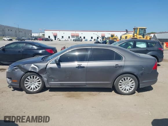 ✅ 2012 Ford Fusion Hybrid • VIN: 3FADP0L35CR241498 • Lot: 42854085. Listed on IAAI with 150,059 mi. Free auction sales archive from the USA and detailed vehicle history report at DreamBid. Image 14.