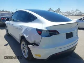 ✅ 2022 Tesla Model Y Long Range • VIN: 7SAYGDEE6NF423753 • Lot: 43165902. Listed on IAAI with 52,678 mi. Free auction sales archive from the USA and detailed vehicle history report at DreamBid. Image 3.