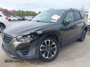 ✅ 2016 Mazda CX-5 Grand Touring • VIN: JM3KE4DY6G0672342 • Lot: 43581193. Wystawiony na IAAI z przebiegiem 94 680 mil. Bezpłatny archiwum sprzedaży aukcyjnych z USA i szczegółowy raport historii pojazdu na DreamBid. Zdjęcie 6.
