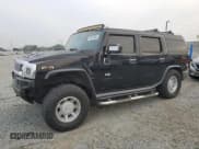 ✅ 2003 Hummer H2 • VIN: 5GRGN23U03H137888 • Lot: 90076345. Listed on Copart with 232,599 mi. Free auction sales archive from the USA and detailed vehicle history report at DreamBid. Image 1.
