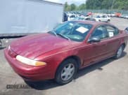 ✅ 2002 Oldsmobile Alero GL1 • VIN: 1G3NL52F52C301358 • Лот: 43064600. Опубликован ранее на IAAI с пробегом 164 000 миль. Бесплатный доступ к архиву аукционных продаж из США и подробный отчёт об истории автомобиля на DreamBid. Изображение 2.