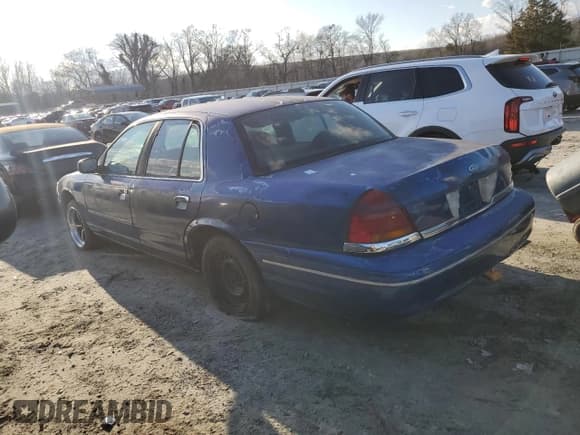 ✅ 1998 Ford Crown Victoria Police • VIN: 2FAFP71W5WX174213 • Lot: 87191094. Listed on Copart with 288,723 mi. Free auction sales archive from the USA and detailed vehicle history report at DreamBid. Image 2.