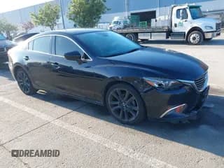 ✅ 2016 Mazda 6 i Grand Touring • VIN: JM1GJ1W56G1435579 • Lot: 41129889. Wystawiony na IAAI z przebiegiem 124 419 mil. Bezpłatny archiwum sprzedaży aukcyjnych z USA i szczegółowy raport historii pojazdu na DreamBid. Zdjęcie 1.