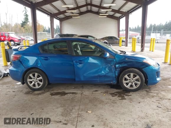 ✅ 2012 Mazda 3 i Grand Touring • VIN: JM1BL1W87C1675605 • Lot: 43588366. Listed on IAAI with 230,489 mi. Free auction sales archive from the USA and detailed vehicle history report at DreamBid. Image 13.