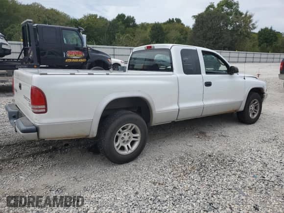 2003 Dodge Dakota SLT with VIN 1D7HL42X93S256342, listed as a Copart auction lot 80322324 with 105,049 mi miles and Salvage title. Bid and sale history available at DreamBid. Image 3.