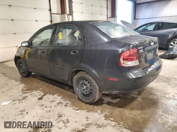 2005 Chevrolet Aveo LS z VIN KL1TD52695B497004, wystawiony jako Copart lot #85917574 z przebiegiem 96 990 mil mil oraz Szkoda całkowita • Salvage title. Historia ofert i sprzedaży dostępna na DreamBid. Obrazek 2.