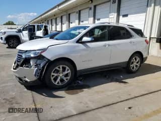 2018 Chevrolet Equinox Premier z VIN 2GNAXMEV0J6156857, wystawiony jako Copart lot #84603905 z przebiegiem 131 139 mil mil oraz Szkoda całkowita • Salvage title. Historia ofert i sprzedaży dostępna na DreamBid. Obrazek 1.