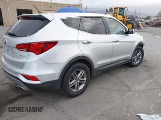 ✅ 2018 Hyundai Santa Fe 2.4L • VIN: 5XYZT3LB6JG571999 • Лот: 43406406. Опубликован ранее на IAAI с пробегом 104 647 миль. Бесплатный доступ к архиву аукционных продаж из США и подробный отчёт об истории автомобиля на DreamBid. Изображение 4.