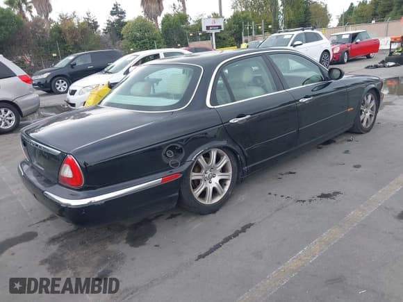 ✅ 2004 Jaguar XJ 8 • VIN: SAJWA71C34SG25046 • Lot: 43320014. Listed on IAAI with 162,777 mi. Free auction sales archive from the USA and detailed vehicle history report at DreamBid. Image 4.