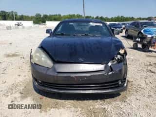 2008 Hyundai Tiburon GT с VIN KMHHN66F08U285592, выставлен на аукционе Copart как лот 69200465 с пробегом 160 838 миль миль и На запчасти • Non repairable. История ставок и продаж доступна на DreamBid. Изображение 5.