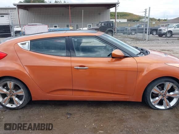 2012 Hyundai Veloster w/Red Int with VIN KMHTC6AD1CU022400, listed as a IAAI auction lot 43233734 with 203,900 mi miles and . Bid and sale history available at DreamBid. Image 14.