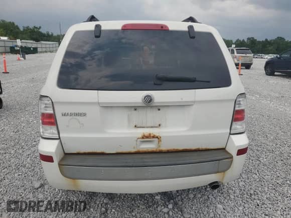 2011 Mercury Mariner z VIN 4M2CN8B71BKJ01749, wystawiony jako Copart lot #64199345 z przebiegiem 157 001 mil mil oraz Szkoda całkowita • Salvage title. Historia ofert i sprzedaży dostępna na DreamBid. Obrazek 6.