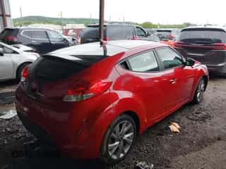 2016 Hyundai Veloster z VIN KMHTC6AD1GU272922, wystawiony jako IAAI lot #43115743 z przebiegiem 85 156 mil mil oraz . Historia ofert i sprzedaży dostępna na DreamBid. Obrazek 4.