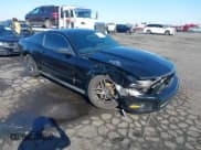 ✅ 2012 Ford Mustang Premium • VIN: 1ZVBP8AM4C5261141 • Lot: 43217325. Listed on IAAI with 129,419 mi. Free auction sales archive from the USA and detailed vehicle history report at DreamBid. Image 1.