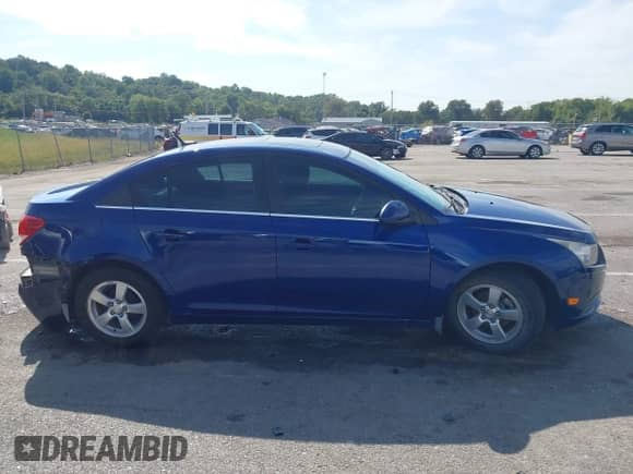 2013 Chevrolet Cruze 1LT z VIN 1G1PC5SB5D7110131, wystawiony jako IAAI lot #43332613 z przebiegiem 110 051 mil mil oraz . Historia ofert i sprzedaży dostępna na DreamBid. Obrazek 13.