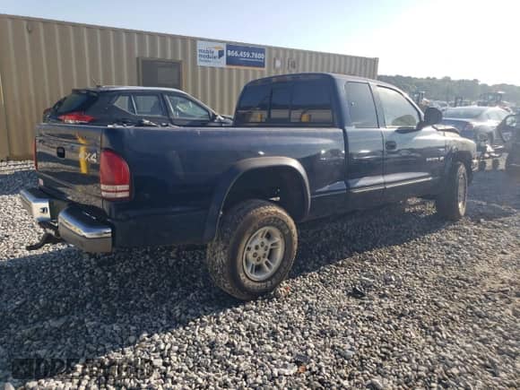 2000 Dodge Dakota Sport z VIN 1B7GG22N5YS733630, wystawiony jako Copart lot #67958294 z przebiegiem Nie podano mil oraz Nie do naprawy • Non repairable. Historia ofert i sprzedaży dostępna na DreamBid. Obrazek 3.