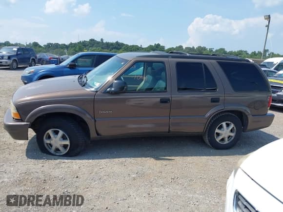 ✅ 1998 Oldsmobile Bravada • VIN: 1GHDT13WXW2702252 • Lot: 42861041. Listed on IAAI with 127,784 mi. Free auction sales archive from the USA and detailed vehicle history report at DreamBid. Image 14.