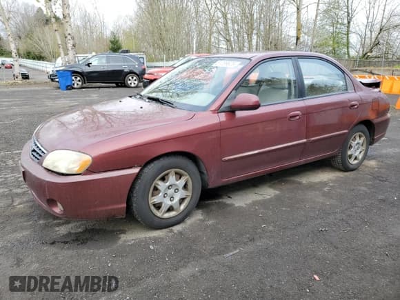 ✅ 2003 Kia Spectra • VIN: KNAFB121835211810 • Lot: 51289625. Listed on Copart with 133,868 mi. Free auction sales archive from the USA and detailed vehicle history report at DreamBid. Image 1.