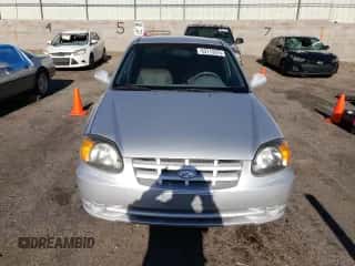 2003 Hyundai Accent GL z VIN KMHCG45C13U494378, wystawiony jako Copart lot #63713375 z przebiegiem 114 772 mil mil oraz Szkoda całkowita • Salvage title. Historia ofert i sprzedaży dostępna na DreamBid. Obrazek 5.