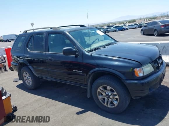 ✅ 2004 Isuzu Rodeo S • VIN: 4S2CK58YX44311680 • Lot: 42476361. Listed on IAAI with 154,693 mi. Free auction sales archive from the USA and detailed vehicle history report at DreamBid. Image 13.