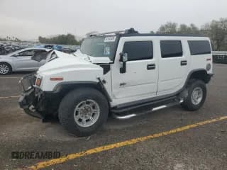 ✅ 2005 Hummer H2 SUV • VIN: 5GRGN23U75H126339 • Лот: 81343495. Опубликован ранее на Copart с пробегом 197 556 миль. Бесплатный доступ к архиву аукционных продаж из США и подробный отчёт об истории автомобиля на DreamBid. Изображение 1.