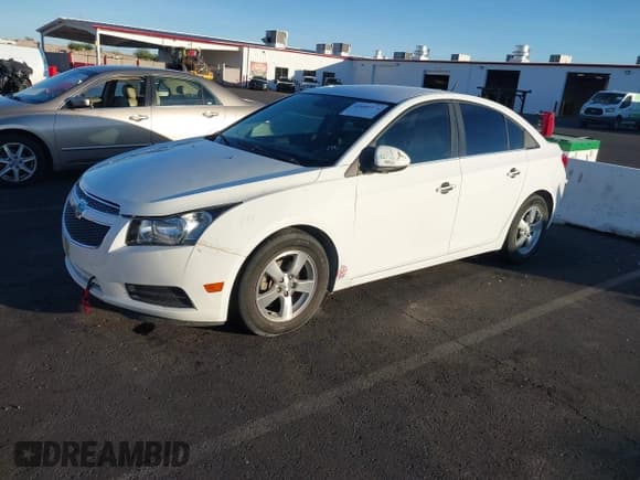 ✅ 2014 Chevrolet Cruze 1LT • VIN: 1G1PC5SB6E7299339 • Lot: 43680374. Listed on IAAI with 98,677 mi. Free auction sales archive from the USA and detailed vehicle history report at DreamBid. Image 2.