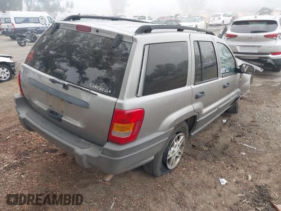 ✅ 2002 Jeep Grand Cherokee • VIN: 1J8GX48S42C147018 • Lot: 43589496. Listed on IAAI with 192,014 mi. Free auction sales archive from the USA and detailed vehicle history report at DreamBid. Image 4.