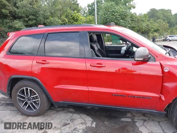 2021 Jeep Grand Cherokee Trailhawk with VIN 1C4RJFLGXMC579888, listed as a IAAI auction lot 42951354 with 76,948 mi miles and . Bid and sale history available at DreamBid. Image 14.