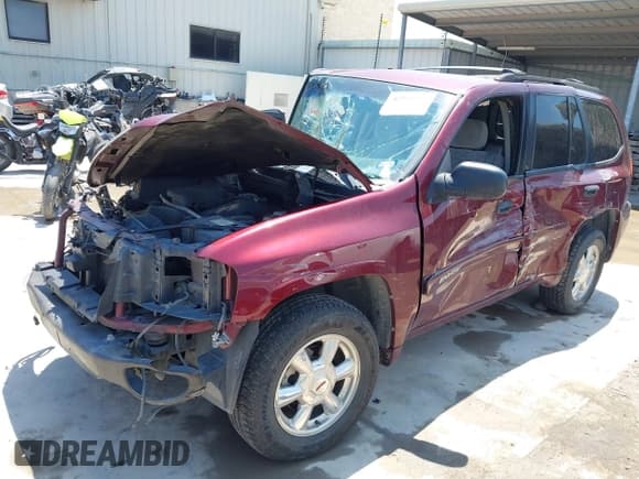 ✅ 2004 GMC Envoy SLE • VIN: 1GKDS13S042252313 • Lot: 42312937. Listed on IAAI with 107,385 mi. Free auction sales archive from the USA and detailed vehicle history report at DreamBid. Image 2.