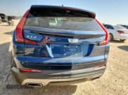 ✅ 2022 Cadillac XT4 AWD Premium Luxury • VIN: 1GYFZDR4XNF153562 • Лот: 61836005. Опубликован ранее на Copart с пробегом 33 091 миль. Бесплатный доступ к архиву аукционных продаж из США и подробный отчёт об истории автомобиля на DreamBid. Изображение 6.