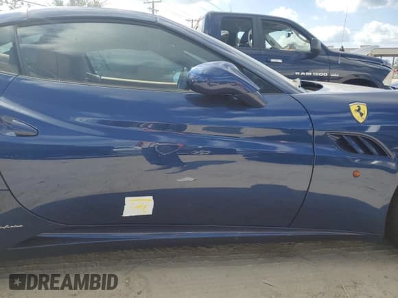 ✅ 2013 Ferrari California • VIN: ZFF65THA9D0194738 • Lot: 77637104. Listed on Copart with 28,670 mi. Free auction sales archive from the USA and detailed vehicle history report at DreamBid. Image 12.