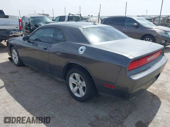 2014 Dodge Challenger SXT 100th Anniversary z VIN 2C3CDYAGXEH298415, wystawiony jako IAAI lot #42133602 z przebiegiem 126 523 mil mil oraz . Historia ofert i sprzedaży dostępna na DreamBid. Obrazek 3.