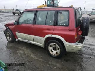 ✅ 1998 Suzuki Sidekick • VIN: JS3TD21VXW4103386 • Lot: 86219924. Listed on Copart with 172,959 mi. Free auction sales archive from the USA and detailed vehicle history report at DreamBid. Image 2.