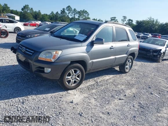 ✅ 2006 Kia Sportage LX • VIN: KNDJF723267292673 • Lot: 42705097. Wystawiony na IAAI z przebiegiem 99 258 mil. Bezpłatny archiwum sprzedaży aukcyjnych z USA i szczegółowy raport historii pojazdu na DreamBid. Zdjęcie 17.