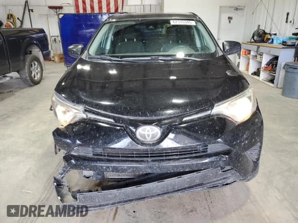 ✅ 2018 Toyota RAV4 LE • VIN: 2T3BFREV9JW766015 • Lot: 62315345. Wystawiony na Copart z przebiegiem 143 516 mil. Bezpłatny archiwum sprzedaży aukcyjnych z USA i szczegółowy raport historii pojazdu na DreamBid. Zdjęcie 5.