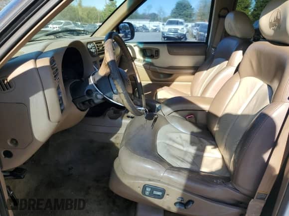 2000 Chevrolet Blazer LT with VIN 1GNDT13WXY2236550, listed as a Copart auction lot 77170574 with 221,994 mi miles and Salvage title. Bid and sale history available at DreamBid. Image 7.