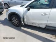 ✅ 2016 Mazda CX-5 Touring • VIN: JM3KE2CY0G0694939 • Lot: 43401057. Wystawiony na IAAI z przebiegiem 125 867 mil. Bezpłatny archiwum sprzedaży aukcyjnych z USA i szczegółowy raport historii pojazdu na DreamBid. Zdjęcie 6.