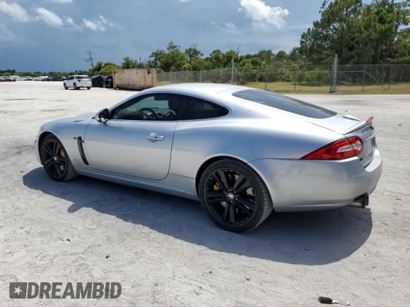 ✅ 2011 Jaguar XK XKR • VIN: SAJWA4DC3BMB42457 • Lot: 61157735. Listed on Copart with 128,452 mi. Free auction sales archive from the USA and detailed vehicle history report at DreamBid. Image 2.