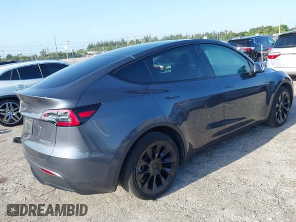 ✅ 2023 Tesla Model Y Long Range • VIN: 7SAYGDEE5PA099226 • Lot: 42004061. Listed on IAAI with 10,607 mi. Free auction sales archive from the USA and detailed vehicle history report at DreamBid. Image 4.