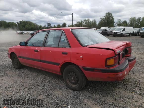 ✅ 1991 Mazda Protege DX • VIN: JM1BG2242M0264276 • Lot: 67682584. Wystawiony na Copart z przebiegiem 189 297 mil. Bezpłatny archiwum sprzedaży aukcyjnych z USA i szczegółowy raport historii pojazdu na DreamBid. Zdjęcie 2.