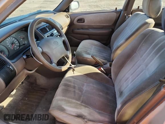 ✅ 1997 Toyota Corolla CE • VIN: 1NXBA02E0VZ623662 • Lot: 81852405. Wystawiony na Copart z przebiegiem 179 792 mil. Bezpłatny archiwum sprzedaży aukcyjnych z USA i szczegółowy raport historii pojazdu na DreamBid. Zdjęcie 7.