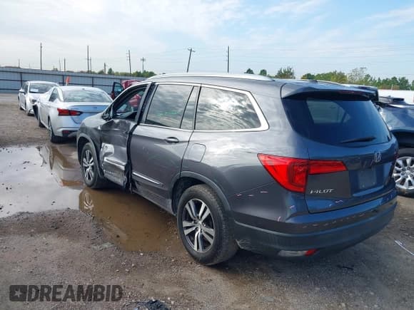 ✅ 2018 Honda Pilot EX-L • VIN: 5FNYF5H59JB027960 • Lot: 43543303. Listed on IAAI with 157,573 mi. Free auction sales archive from the USA and detailed vehicle history report at DreamBid. Image 3.