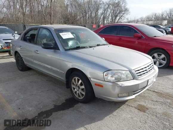 ✅ 2002 Kia Optima LX • VIN: KNAGD128225182377 • Lot: 41825710. Wystawiony na IAAI z przebiegiem 214 606 mil. Bezpłatny archiwum sprzedaży aukcyjnych z USA i szczegółowy raport historii pojazdu na DreamBid. Zdjęcie 1.