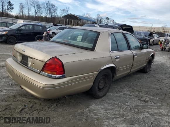 ✅ 1999 Ford Crown Victoria • VIN: 2FAFP73W5XX139721 • Lot: 45017875. Listed on Copart with 213,296 mi. Free auction sales archive from the USA and detailed vehicle history report at DreamBid. Image 3.