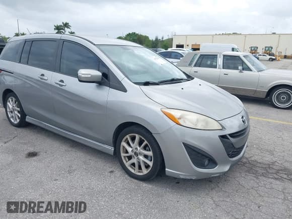 ✅ 2013 Mazda 5 Touring • VIN: JM1CW2CL5D0160104 • Lot: 41722470. Listed on IAAI with 135,708 mi. Free auction sales archive from the USA and detailed vehicle history report at DreamBid. Image 1.