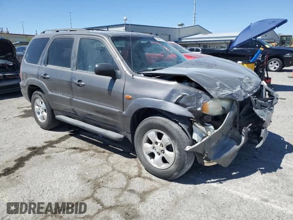 ✅ 2003 Mazda Tribute ES • VIN: 4F2CZ06113KM34892 • Lot: 66942765. Listed on Copart with 240,643 mi. Free auction sales archive from the USA and detailed vehicle history report at DreamBid. Image 4.