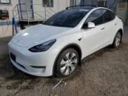 ✅ 2023 Tesla Model Y Long Range • VIN: 7SAYGDEE9PA098533 • Лот: 82690655. Опубликован ранее на Copart с пробегом 59 560 миль. Бесплатный доступ к архиву аукционных продаж из США и подробный отчёт об истории автомобиля на DreamBid. Изображение 1.