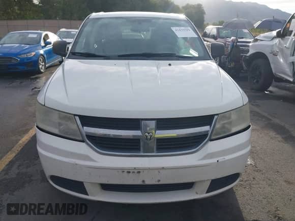 2010 Dodge Journey SE z VIN 3D4PG4FB7AT198982, wystawiony jako IAAI lot #43435599 z przebiegiem 202 565 mil mil oraz . Historia ofert i sprzedaży dostępna na DreamBid. Obrazek 12.